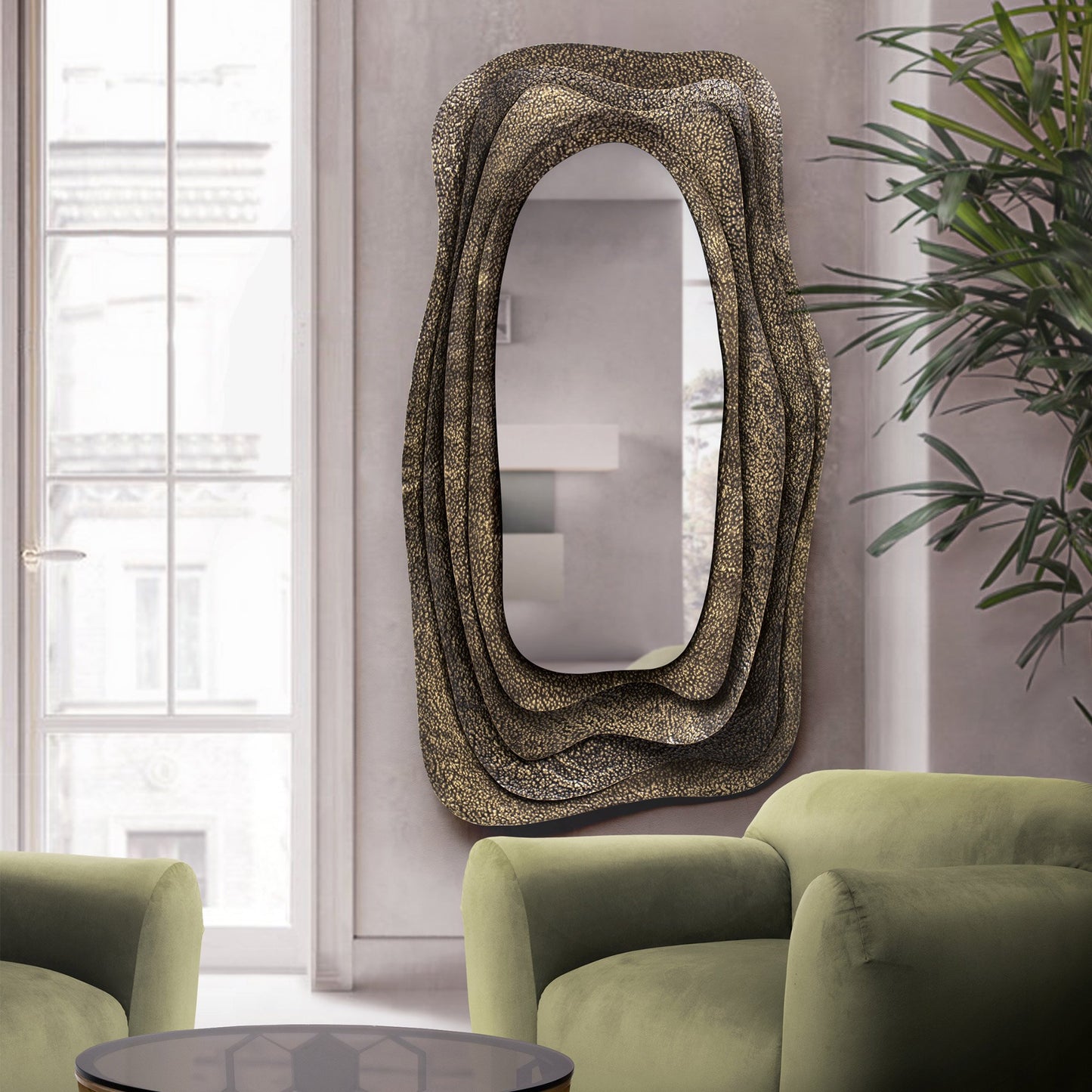 Dark brass sculptural mirror in luxury home
