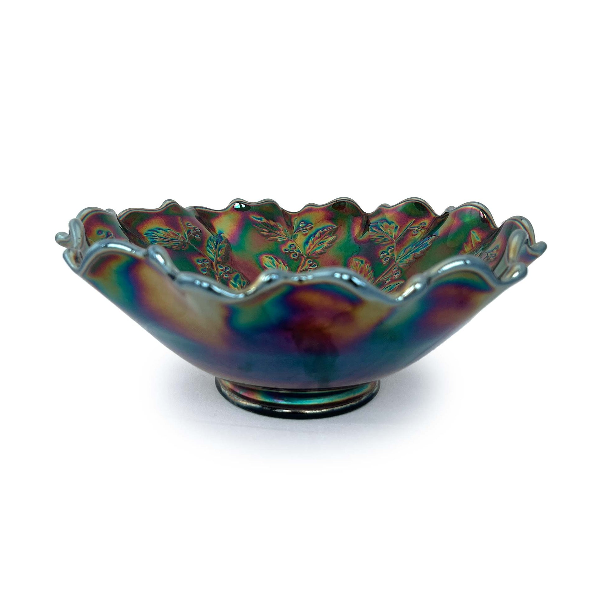 Fenton carnival glass bowl with polished exterior and leaf and berry design on interior. Shows rainbow colours.