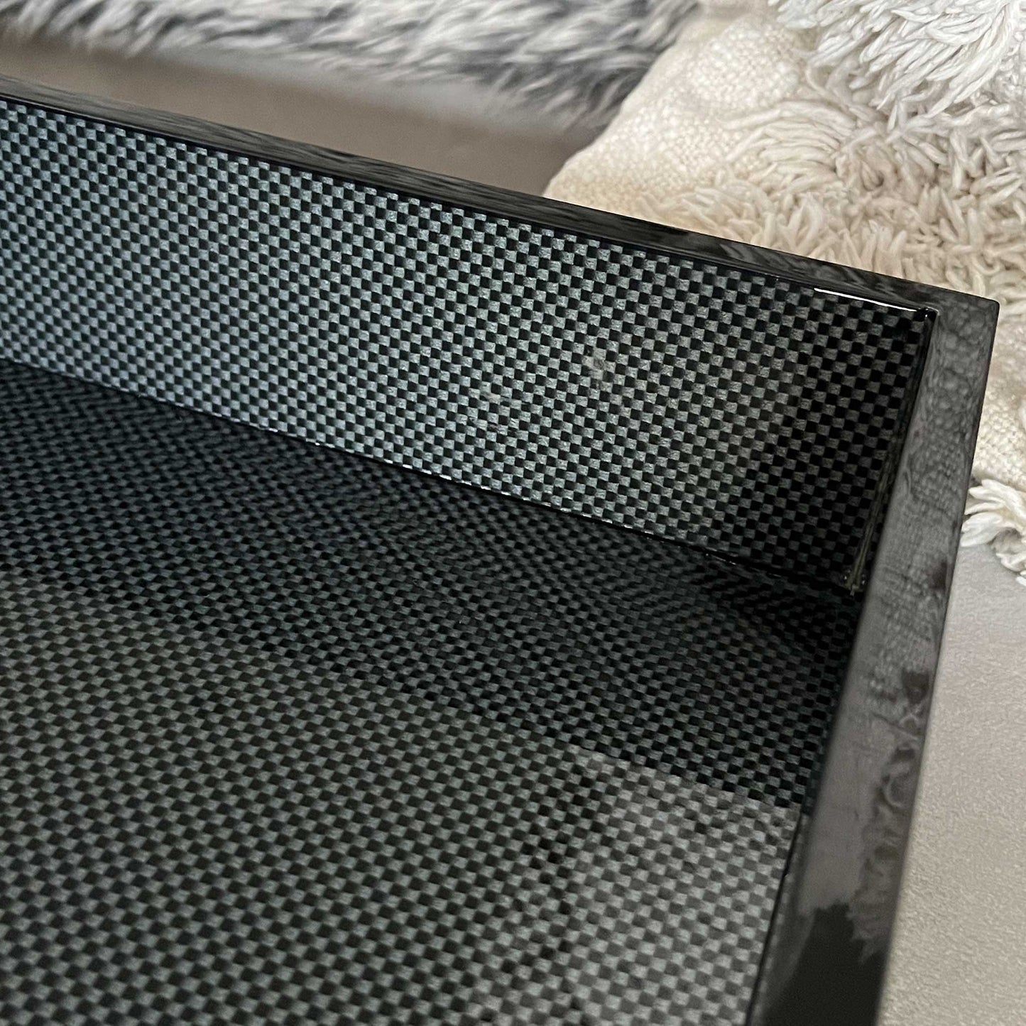 Close up of carbon black luxury large ottoman tray