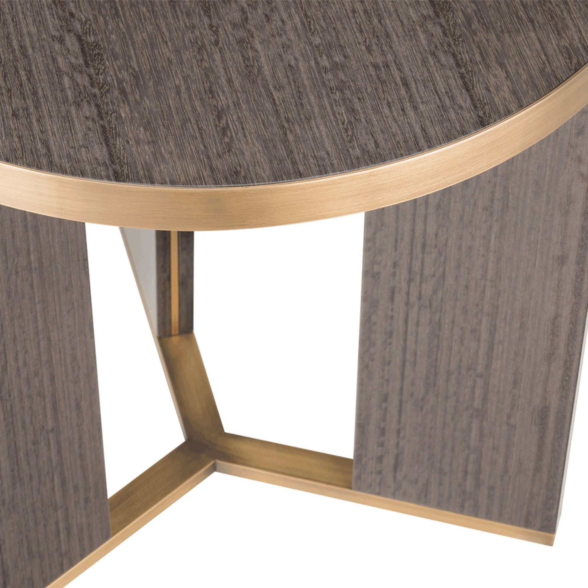 Close up of luxury small round three legged accent table with brass detail