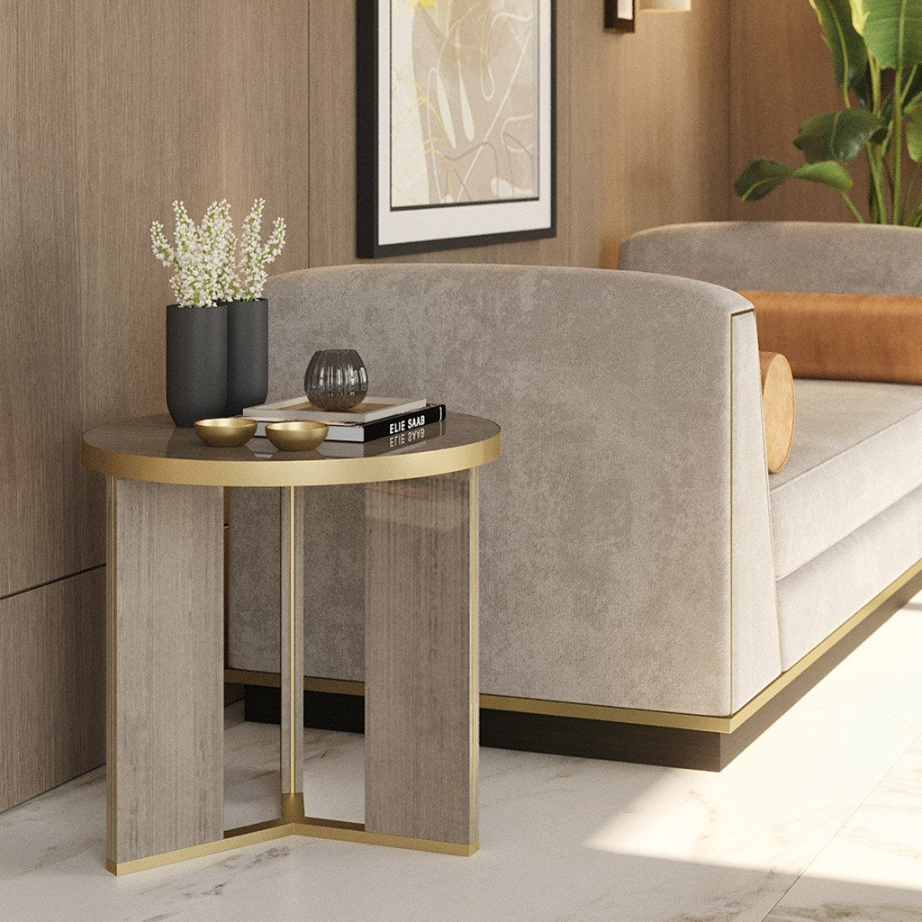 Lifestyle image of luxury small round three legged accent table with brass detail