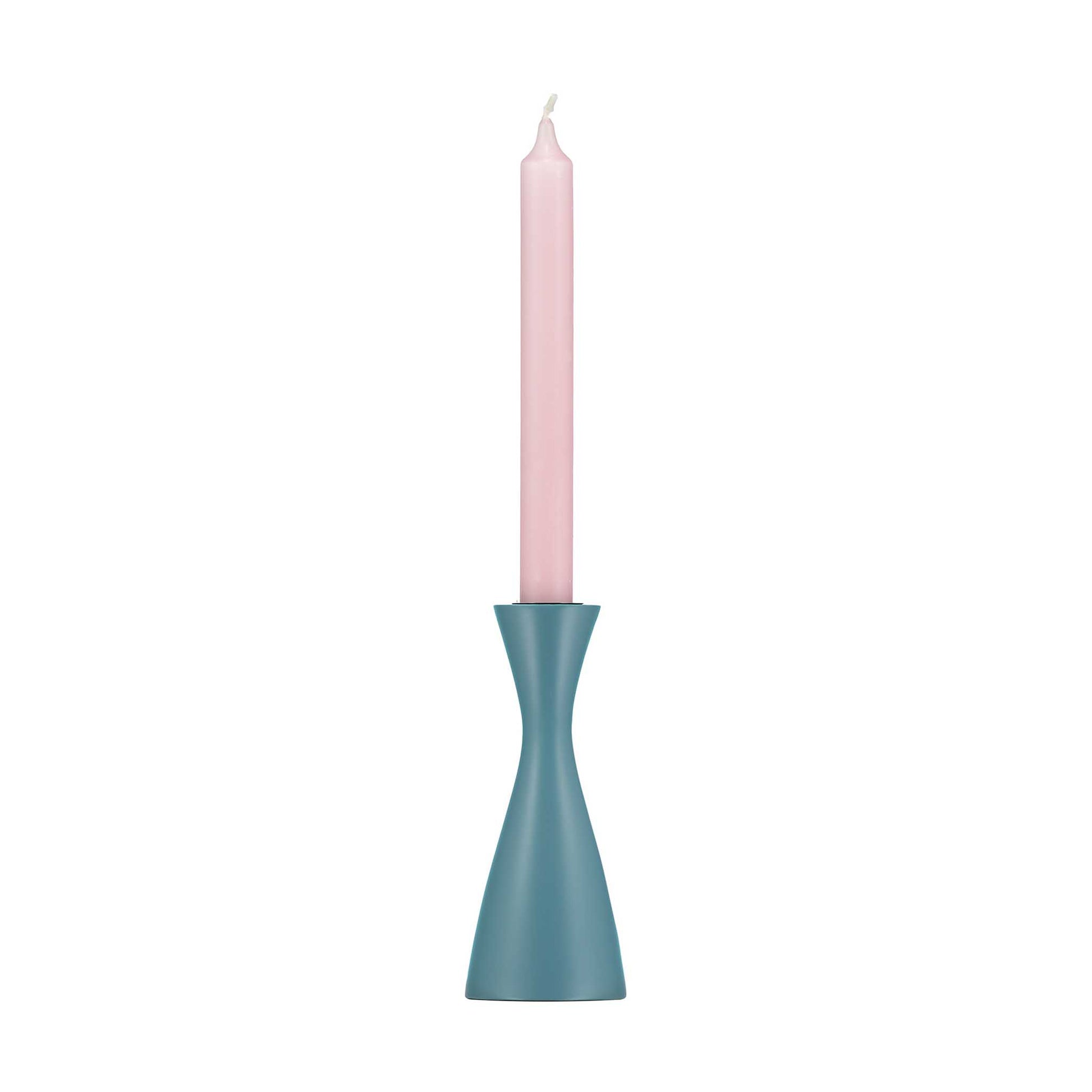 Minimal plain blue candleholder with tall pale pink dinner candle