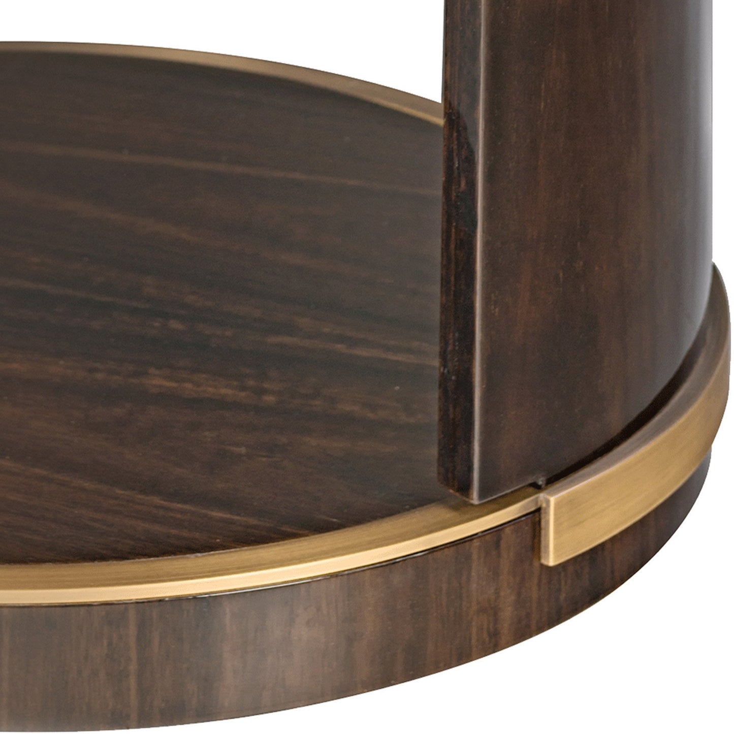 close up image showing the dark high gloss wood structure and brushed brass edging