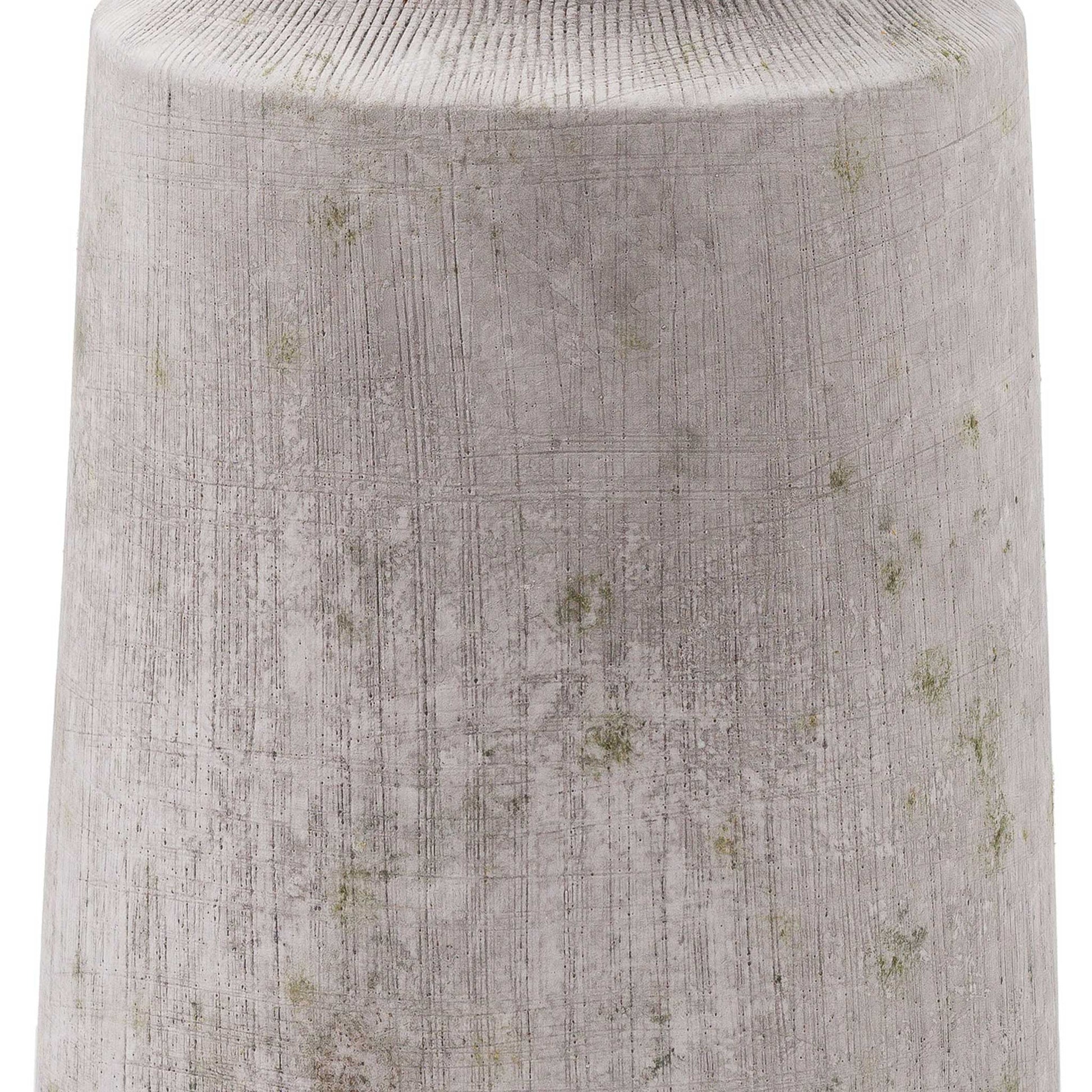 Close up of urn style stone effect vase with horizontal textured lines vase with cinched neck