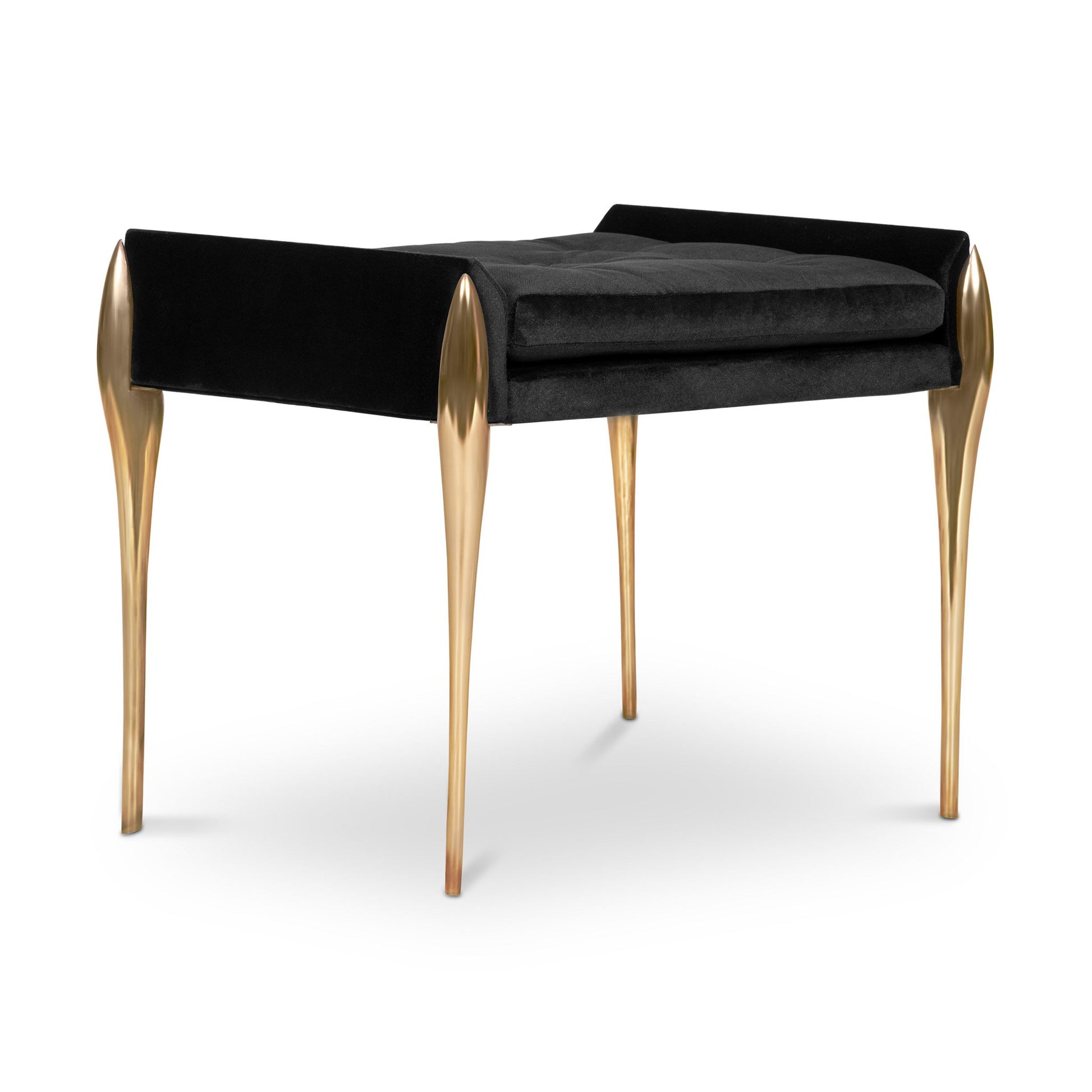 Side view of button tufted dressing table stool with stiletto type brass legs