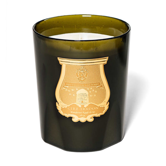 cire trudon candle in a green glass jar with a luxury gold label