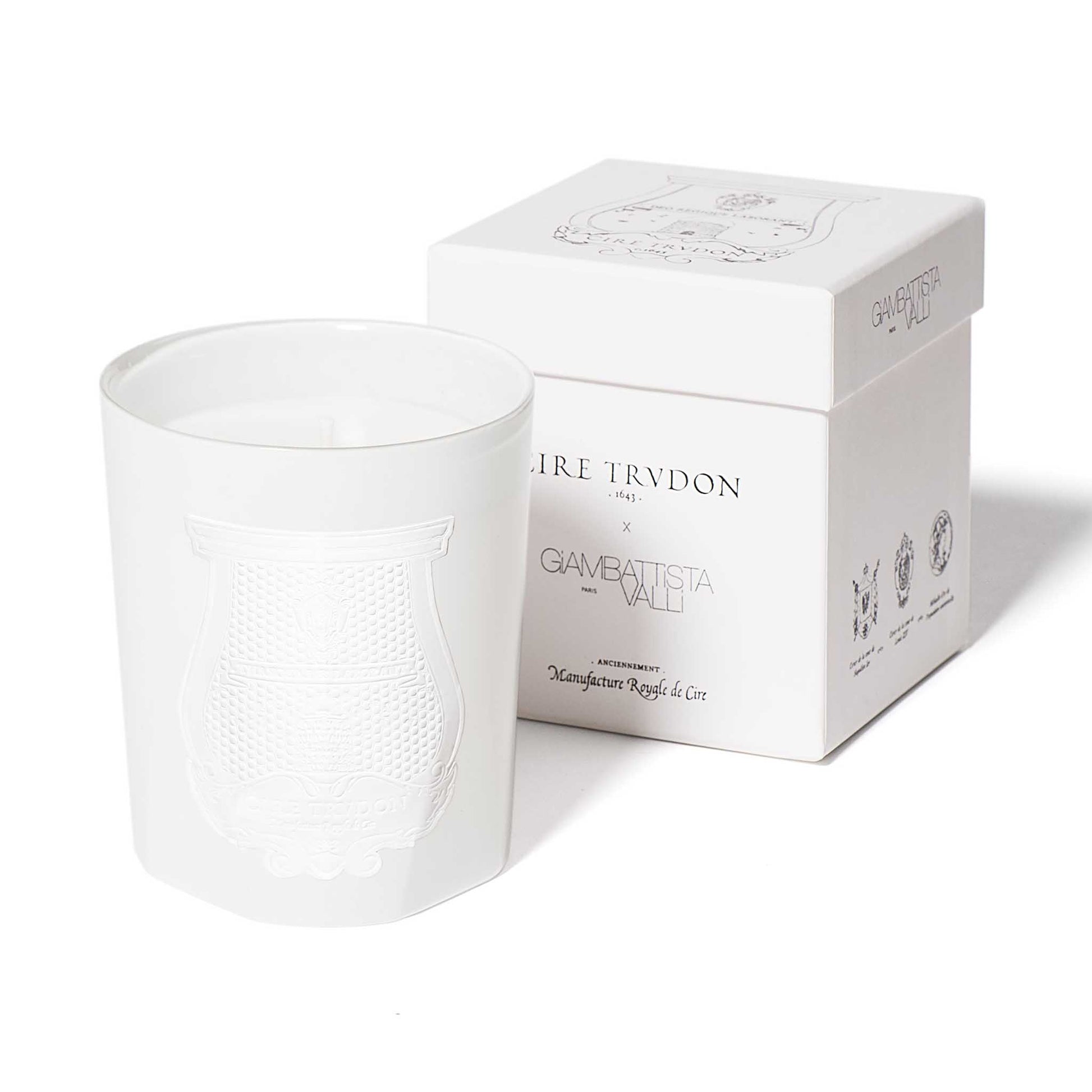 cire trudon candle in a white glass jar with a luxury white label. this candle comes in a white box with black detailing