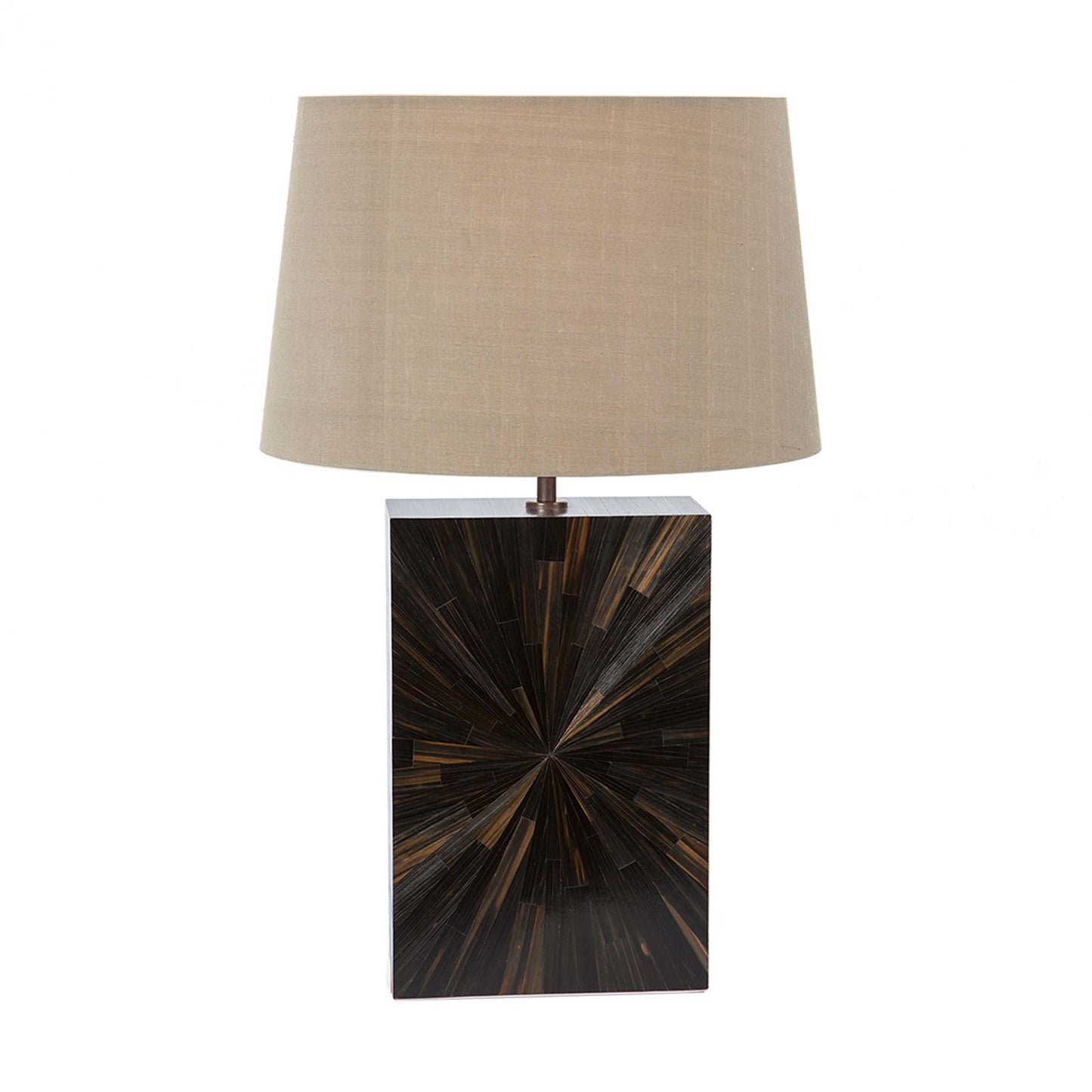 Straw marquetry lamp with a starburst pattern in a minimal rectangular block design in dark brown and black tones the lamp is shown with a  beige tapered linen lampshade