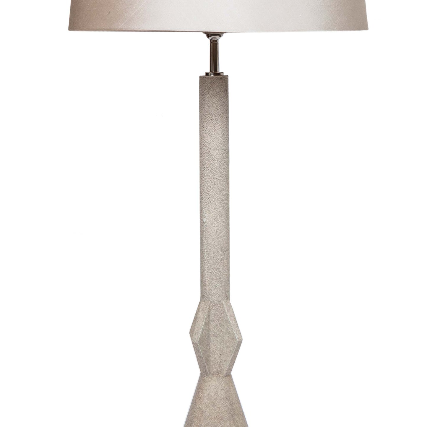 Close up minimal art deco style light grey lamp covered in shagreen. Shown with cream silk shade.