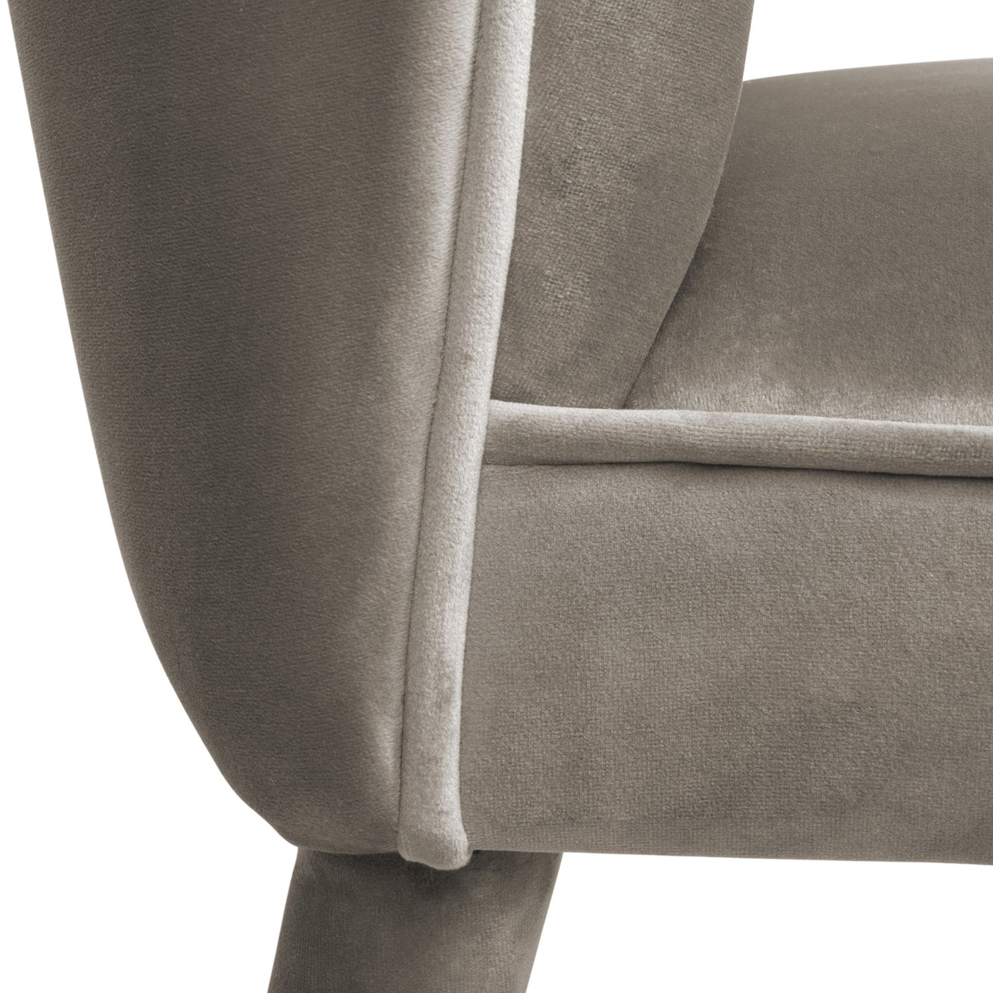 close up view of mid century modern style dining chair in a luxury fawn coloured velvet