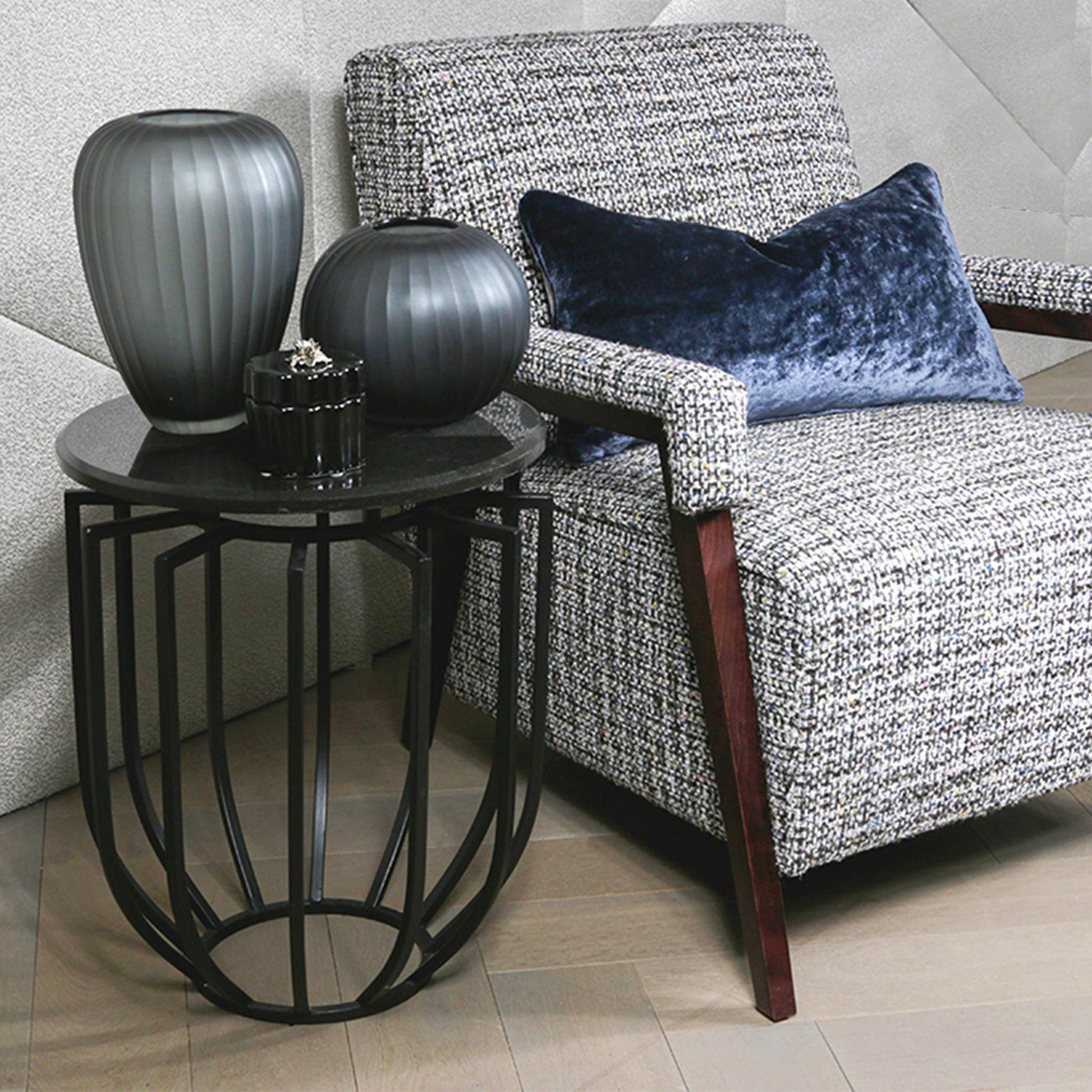 Modern end table for living room with black stone top in luxury living room