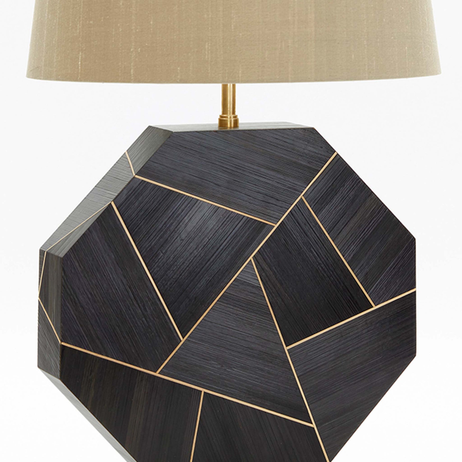 Close up of deep brown and black toned straw marquetry octagonal lamp base with brass inlay and base