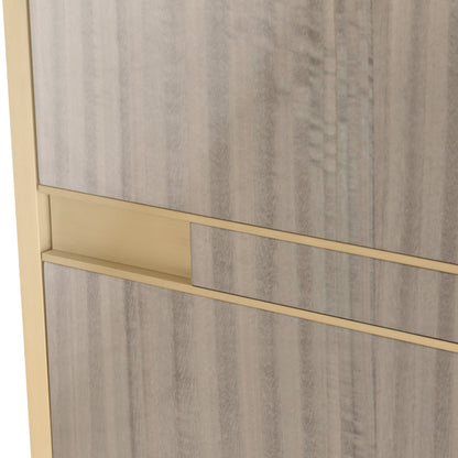 Close up of luxury four door sideboard with diagonal light wood grain and dark wood legs and brass details.
