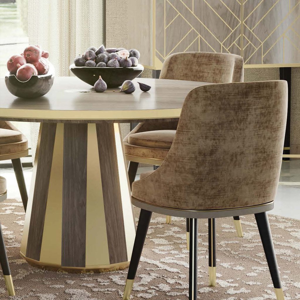 lifestyle image showing the round wooden dining table in a luxury dining room