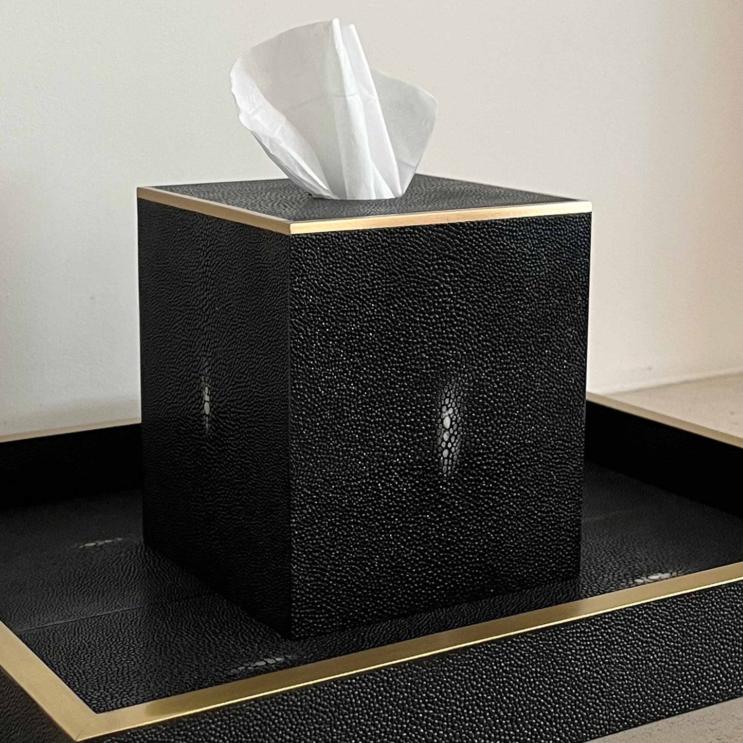 Black square luxury shagreen tissue box and matching tray, both with brass trim 