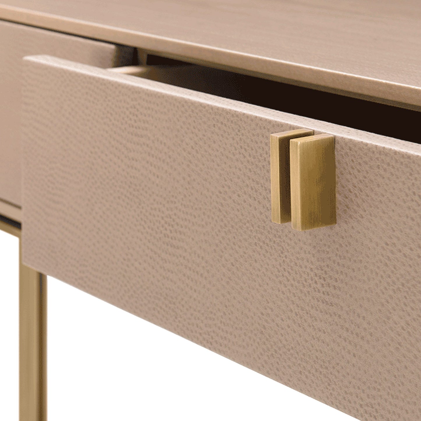 close up image of the wooden console table showing the detailing of the leather finished drawers and brushed brass handles, and the luxurious suede lining on their interior