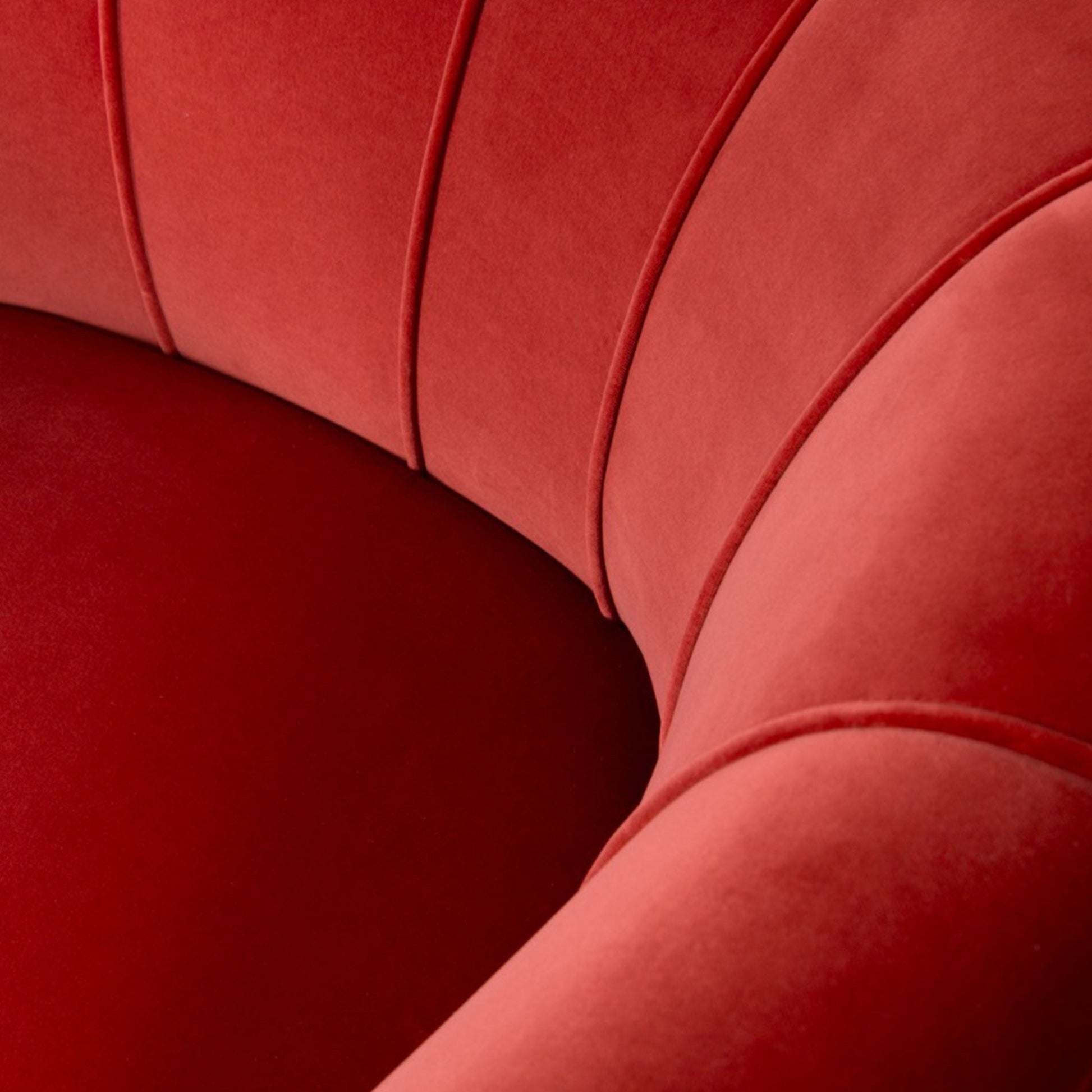 close up image showing the detailing of the upholstered velvet armchair